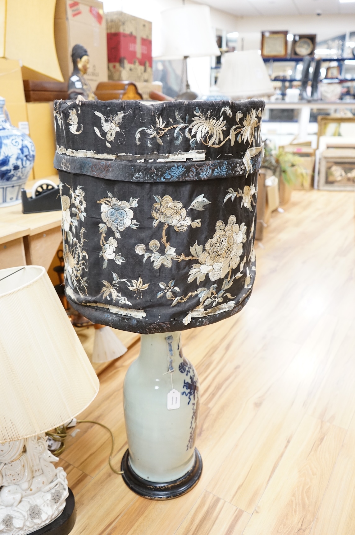A 19th century Chinese underglaze blue celadon ground baluster vase, mounted as a table lamp, with Chinese silk embroidered shade, 112cm high including shade.